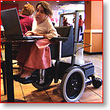 Ruth working at a table in Starbucks